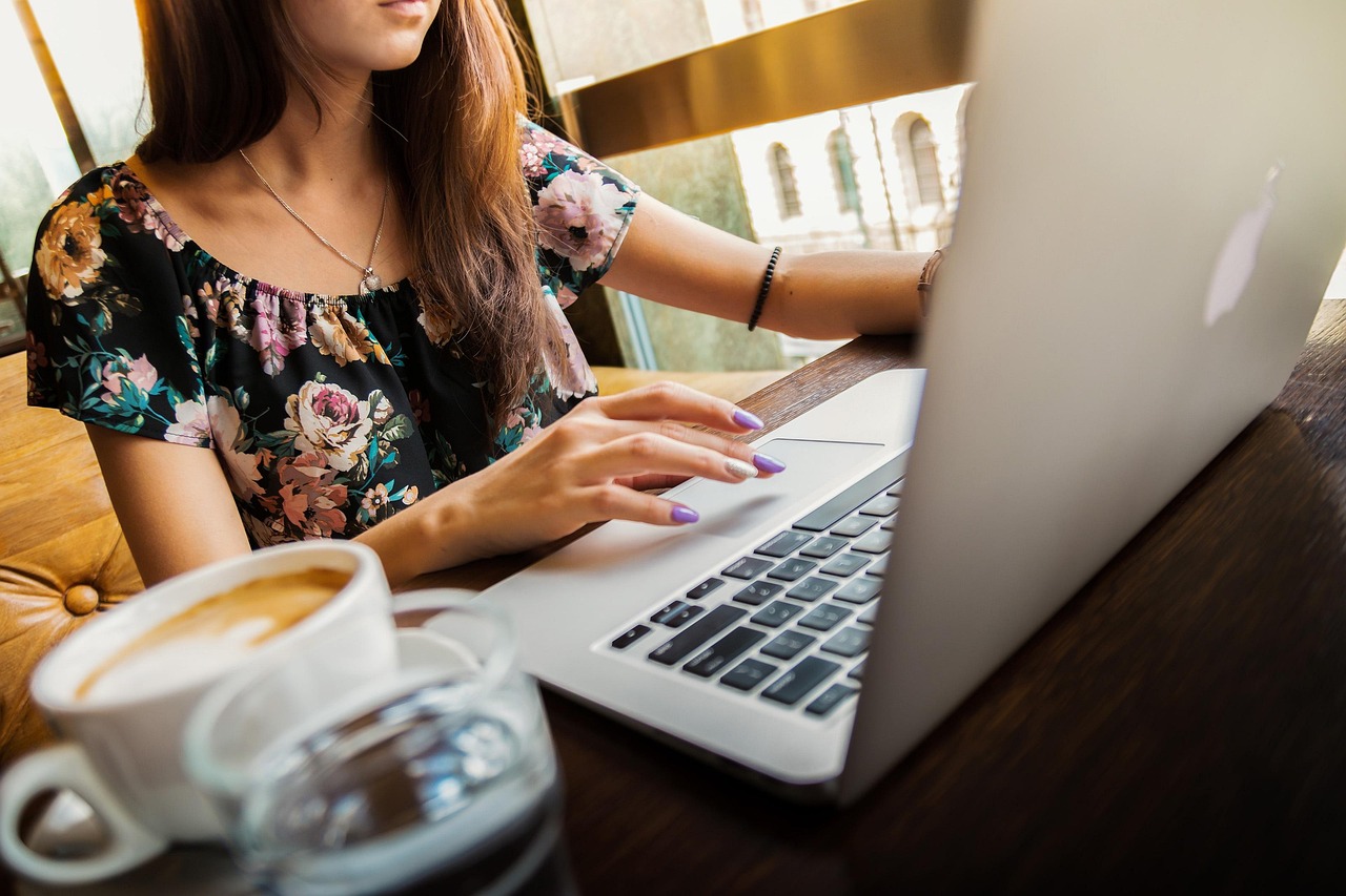 Woman, laptop, desk — Explore Modern Residences at Telok Blangah New Condo & Hougang Central New Condo