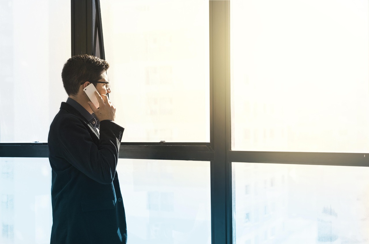 Man, cell phone, tuxedo — Streamlined Borrowing: No Credit Check, No Bank Verification Loans Unveiled