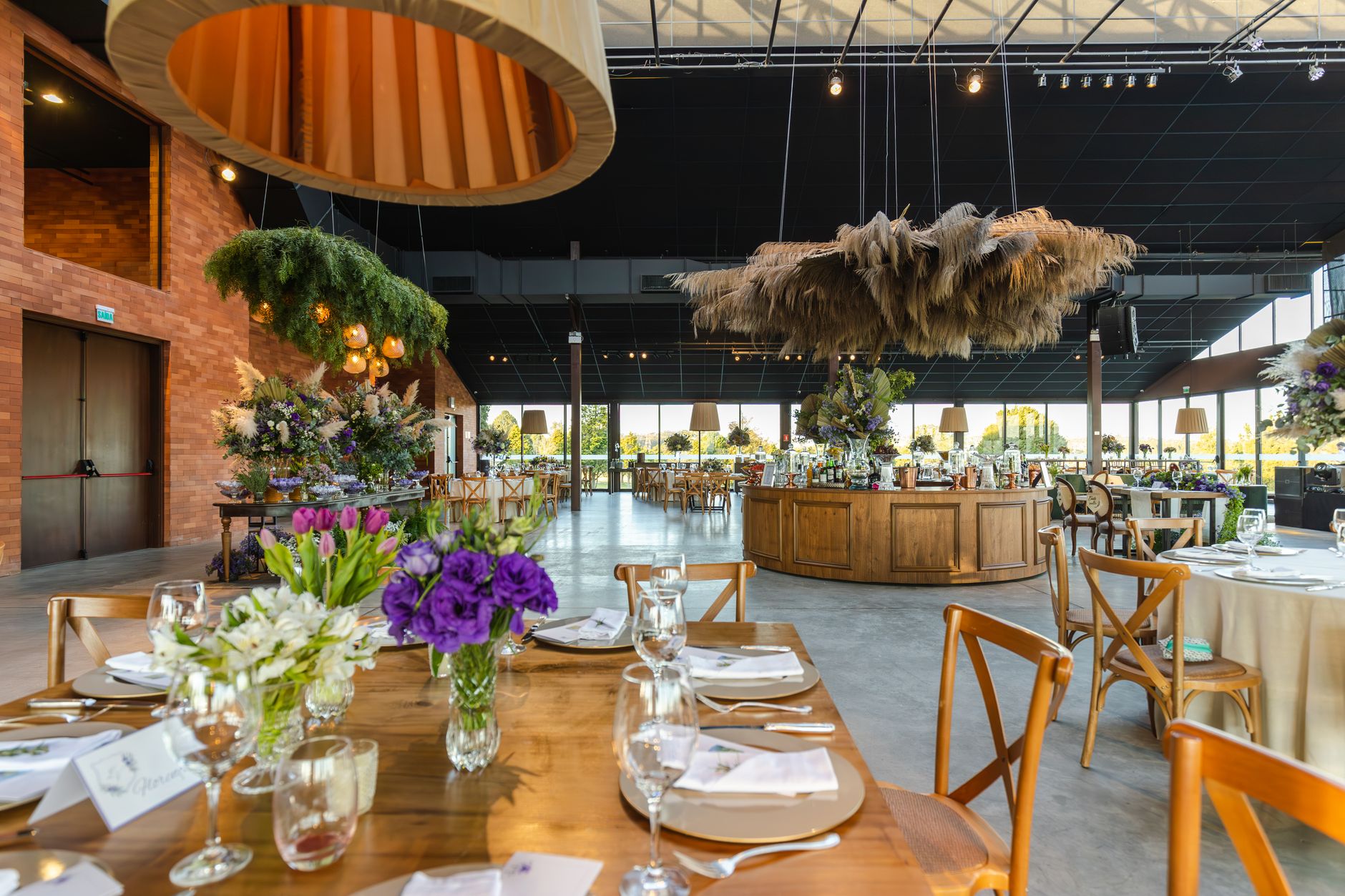 Elegant indoor wedding reception venue with rustic decor and lush floral arrangements. — "Transform Your Space with Stylish G